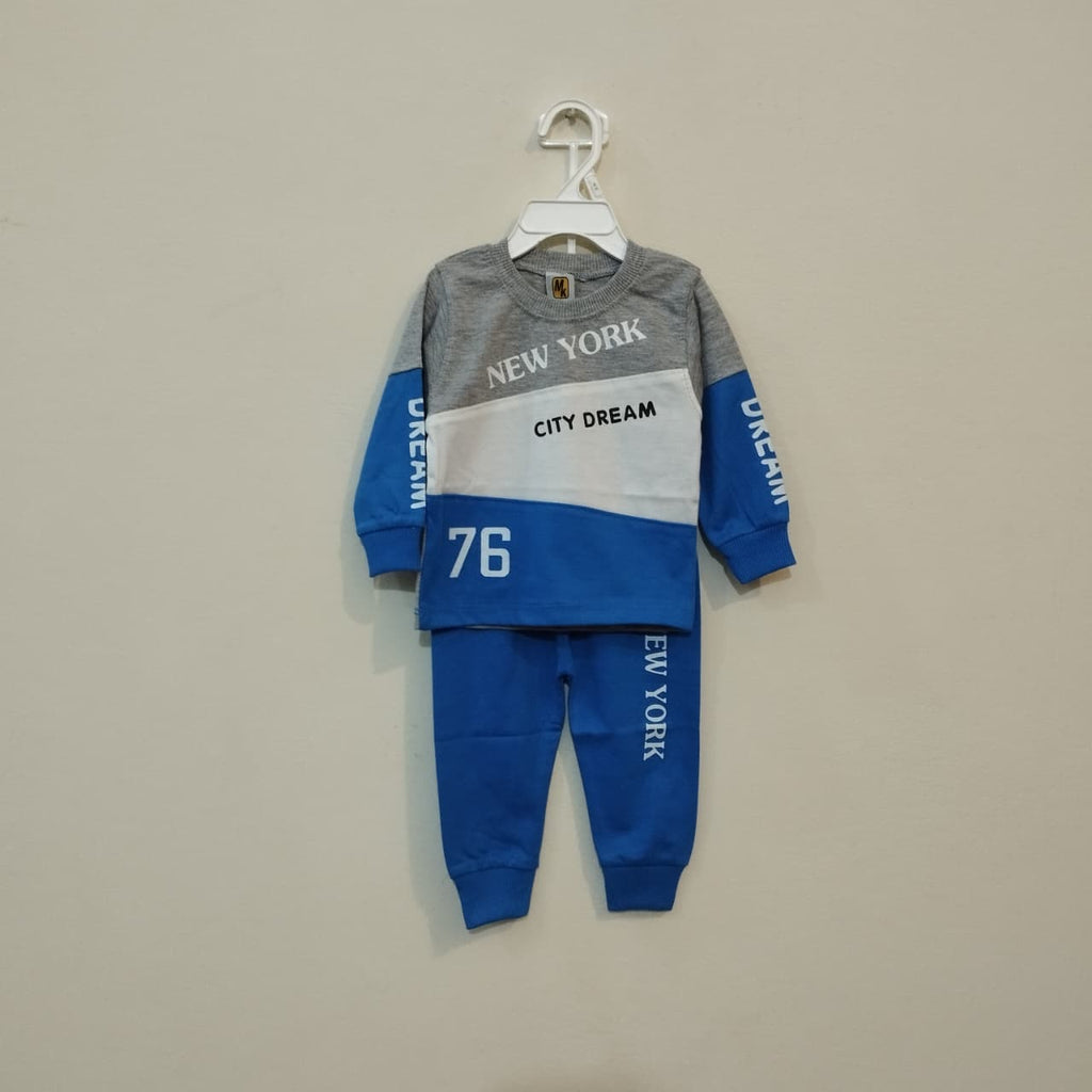 Children's two-piece outfit with gray, blue, and white design on a beige background