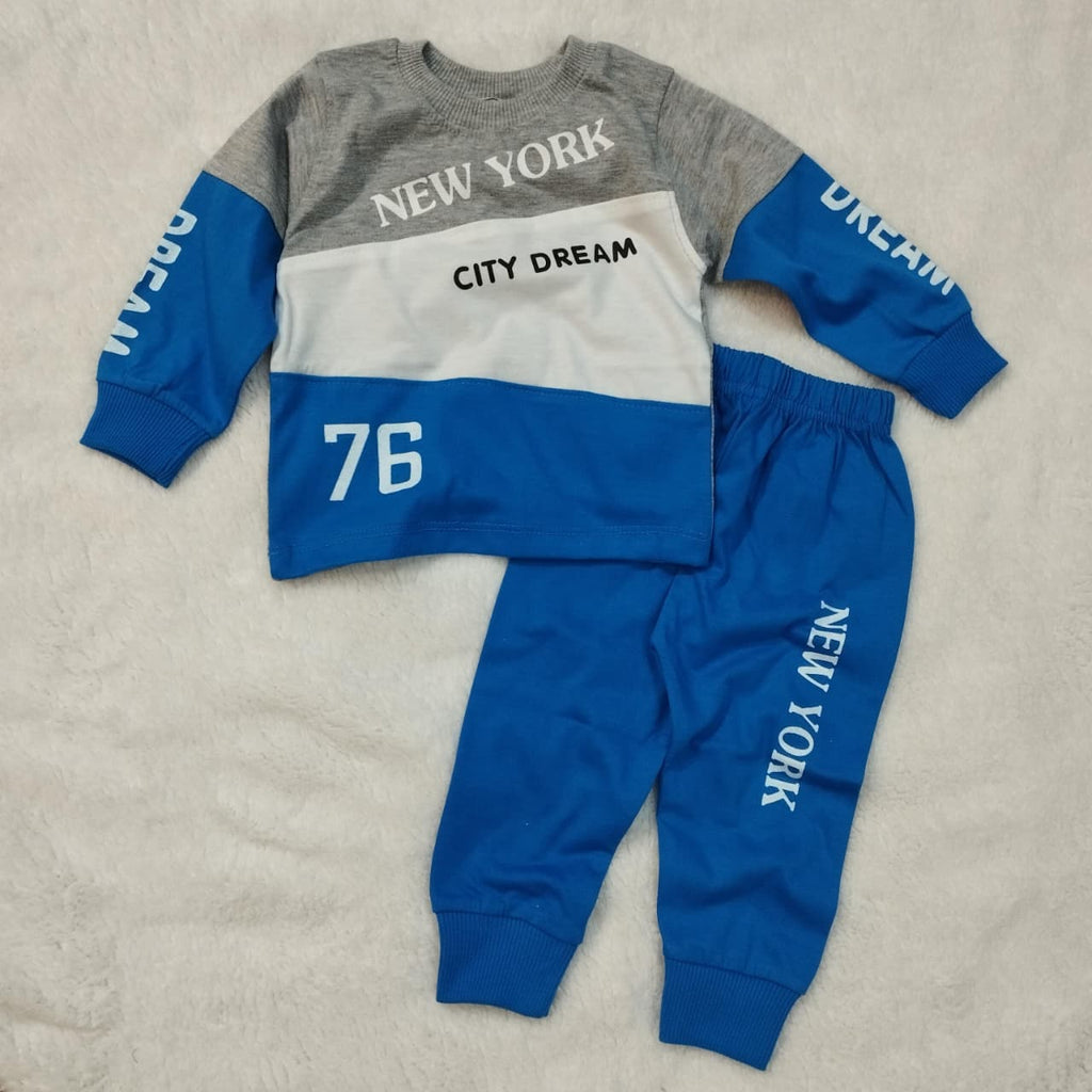 Children's sweatshirt and pants set with 'New York' and 'City Dream' text on a beige background