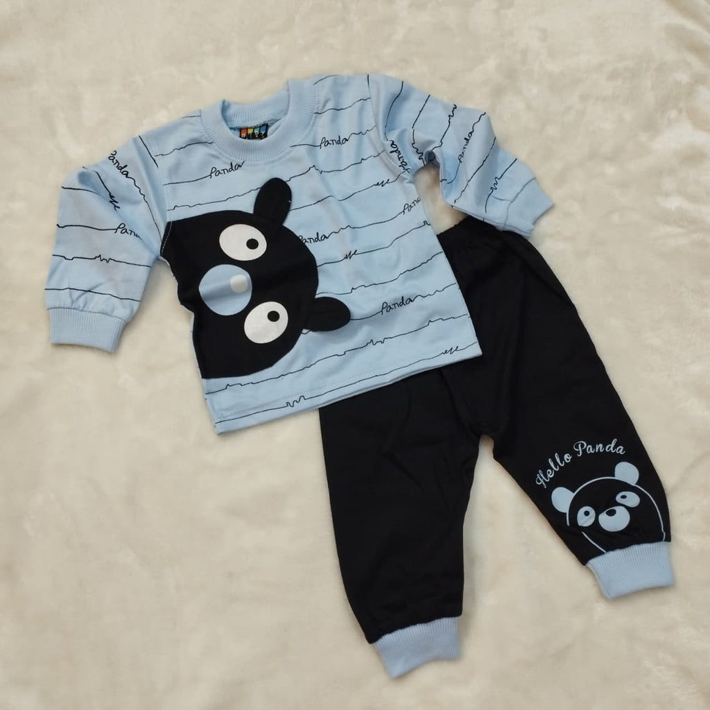 Children's outfit with blue shirt and black pants featuring a panda design on a beige background