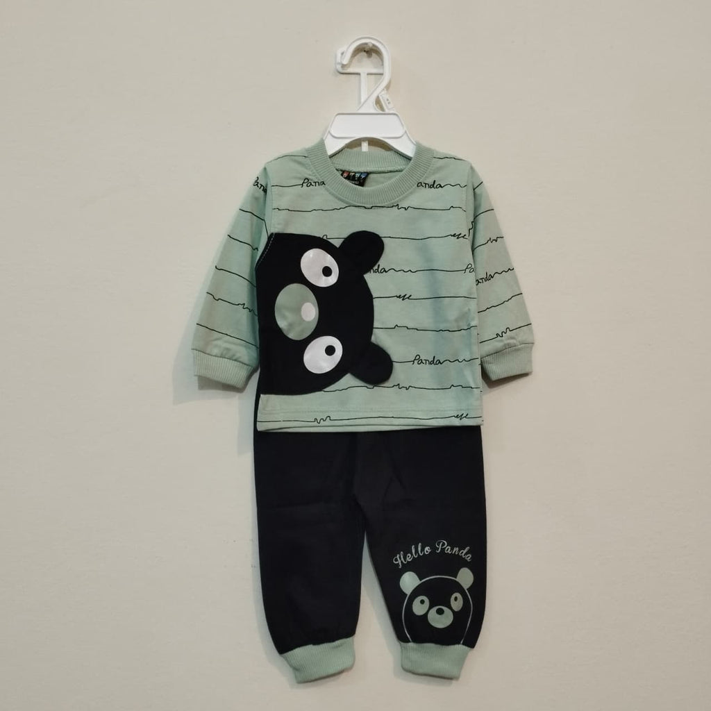 Children's pajama set with panda design on a beige background