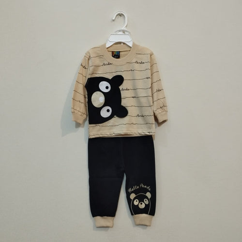 Children's pajama set with panda design on a hanger against a plain background
